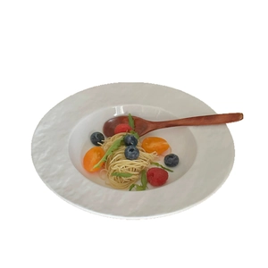 Minimalist white ceramic pasta plate with hammer texture and broad rim for home dining
