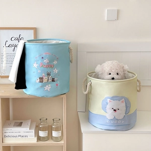 Detail of cute foldable laundry baskets with soft cotton rope handles and puppy patterns