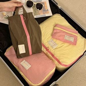 Detail view of large capacity waterproof travel organizers inside a silver suitcase