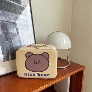 Detail of cute bear printed makeup bag with sturdy top handle and metal dual zippers