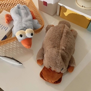 Cute bird and platypus plush pencil cases in a cozy desk setting with high capacity