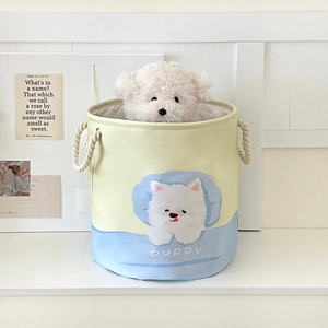 Close-up of canvas laundry hamper with cute puppy print and sturdy cotton rope handles
