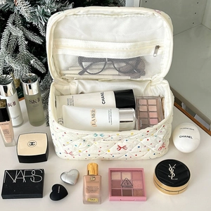 Polka dot bow makeup bag with quilted white finish and large capacity storage