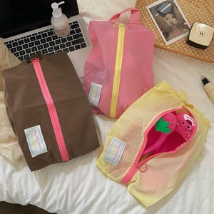 Waterproof nylon travel organizer bags in coffee, pink and yellow with mesh texture