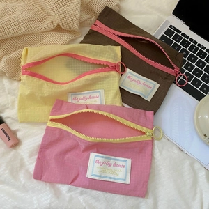 Three-piece colorful nylon storage bag set for travel luggage organization and clothes packing
