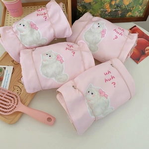 Pink feline print detachable toiletry bag showing roll-up design and elastic cord