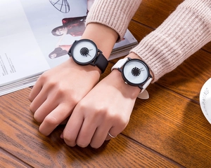 Minimalist quartz watches with unique reverse dial on a textured wooden table scenario
