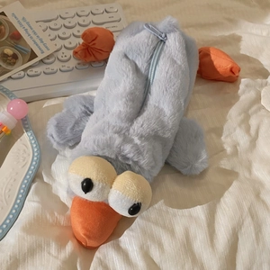 Close-up of soft blue plush duck pencil case featuring fluffy texture and zipper detail