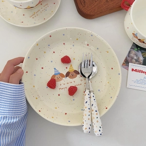 Close-up of cute dog ceramic dinnerware set with starry dots and funny dog text