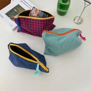 Three large capacity checkered canvas makeup bags in assorted colors with zipper closure