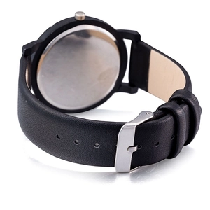 Detail view of the black leather strap and polished silver buckle of the quartz watch