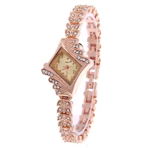 Women's rose gold quartz watch with a diamond-shaped case and rhinestone leaf bracelet