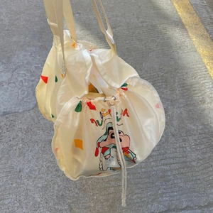 Detail view of cartoon car organizer bag featuring colorful Crayon Shin-chan character print