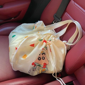 Cartoon car seat organizer featuring Crayon Shin-chan pattern on beige polyester fabric