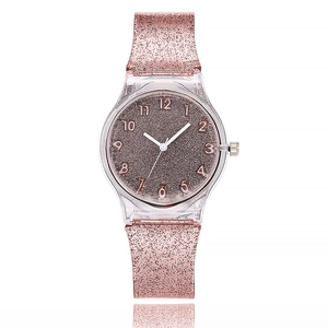 Detail of rose gold glitter dial and transparent case on minimalist quartz watch