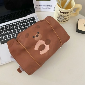 Detail of cute bear printed cosmetic bag with elastic strap and durable fabric