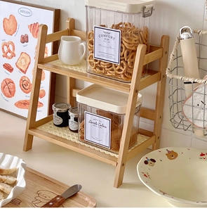 Detail of a 2-tier cream rattan desktop shelf for kitchen and office organization