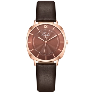 Minimalist women's quartz watch with brown leather strap and rose gold round metal case