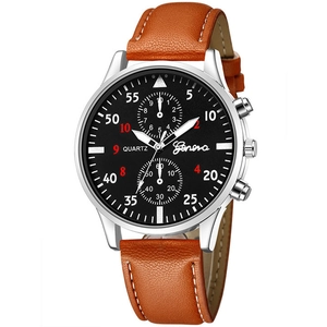Close-up of minimalist black dial quartz watch with brown leather strap and silver case