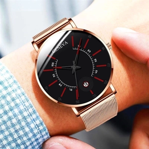 Close-up of Geneva quartz watch with rose gold mesh band and black dial showing calendar