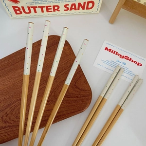 Minimalist Japanese style bamboo chopsticks with colorful polka dots on white matte tips