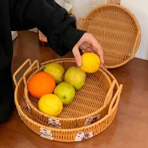 Close-up of woven rattan fruit baskets with cute bear and tiger decorative handles