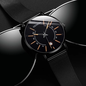 Detail of all-black quartz watch with mesh strap and calendar display on textured background