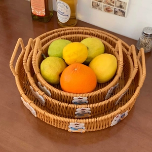 Three-piece nesting woven baskets with cute cartoon bear accents for snack storage