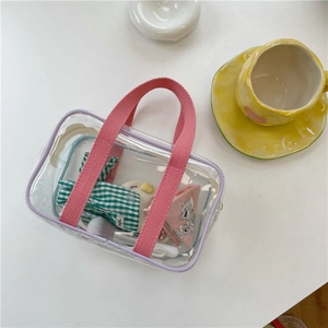 Purple transparent PVC macaron jelly beach bag with pink webbing handles and inner pouch