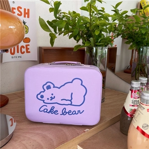 Detail of purple bear cosmetic bag featuring a sturdy handle and secure double zippers