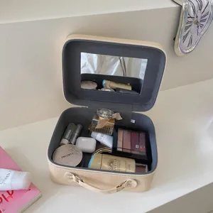 Detail view of the vanity case open with built-in mirror and large inner storage space