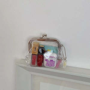 Transparent PVC mini pouch with silver clasp and chain storing lipstick and earbuds