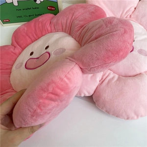 Pink flower plush pillow with a smiling face embroidery on soft velvet fabric