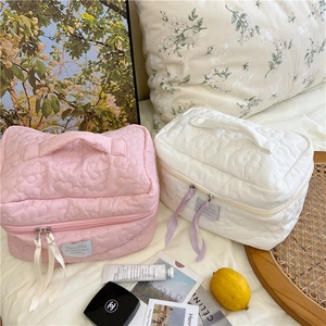 Pastel quilted floral makeup bags in pink and white with spacious double zipper design
