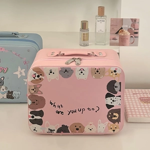 Close-up of pink cream bear makeup box with cartoon dog prints and sturdy leather handle
