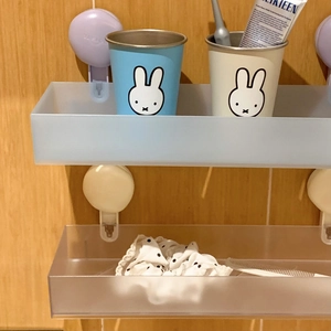Macro detail of frosted double-layer suction cup wall shelf for bathroom storage