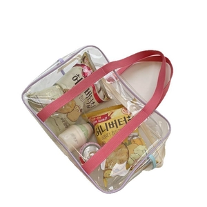 Purple transparent PVC beach bag with pink ribbon handles and high storage capacity
