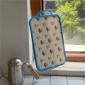 Double-sided cutting board with vintage cherry pattern and blue handle for kitchen