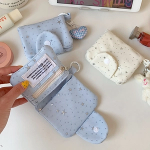 Detailed view of starry fabric card wallet with zipper pocket and bunny pendant charm