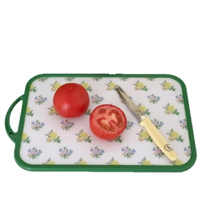 Vintage floral kitchen cutting board with cherry pattern and non-slip handle for food prep