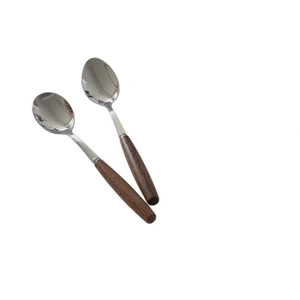 Vintage Korean style stainless steel spoons with wooden handles on white background