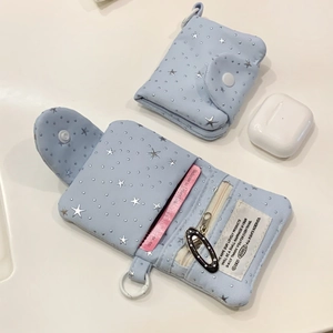 Inside view of star print mini wallet showing card slots and zipper compartment