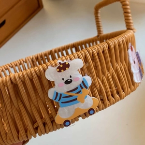 Handwoven rattan-style storage basket with cute bear and rabbit cartoon characters