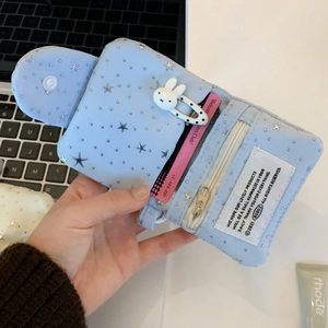 Detail of light blue starry multi-layer mini wallet with cute bunny clip and zipper pouch