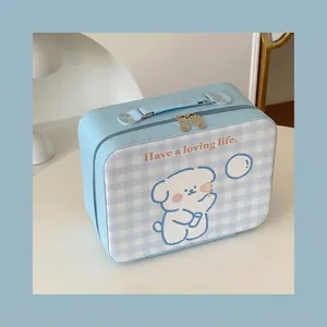 Detail view of large blue checkered makeup case with cute dog and 24x11x18cm dimensions