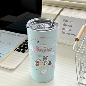 Blue stainless steel insulated puppy cup with metal straw on a modern office desk