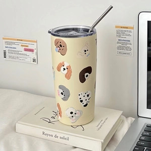 Detail of cartoon dog pattern on cream insulated stainless steel coffee cup with straw