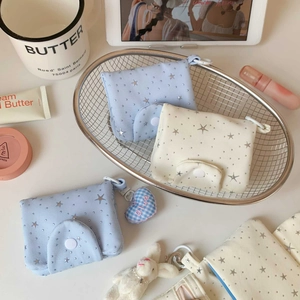 Close-up of star pattern fabric coin purse with snap button and blue heart charm