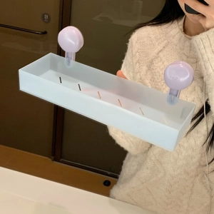 Detail of frosted purple suction wall shelf with bottom drainage for bathroom