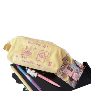 Yellow canvas pencil case with pink embroidery and cute cartoon design for stationery